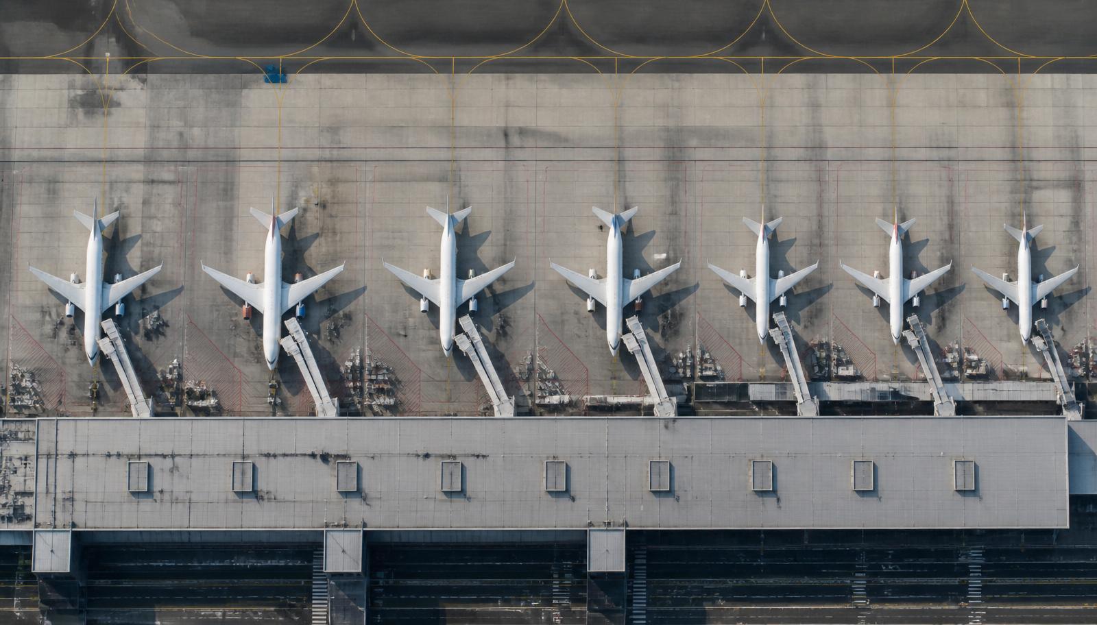 Row of parked airliners from above